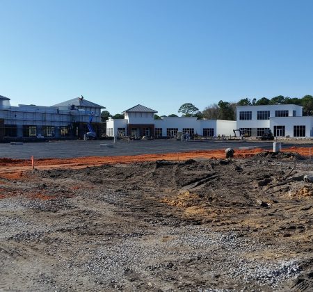 A Train Is Parked On A Dirt Track