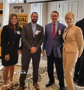 Louis Mexandeau et al. posing for a photo